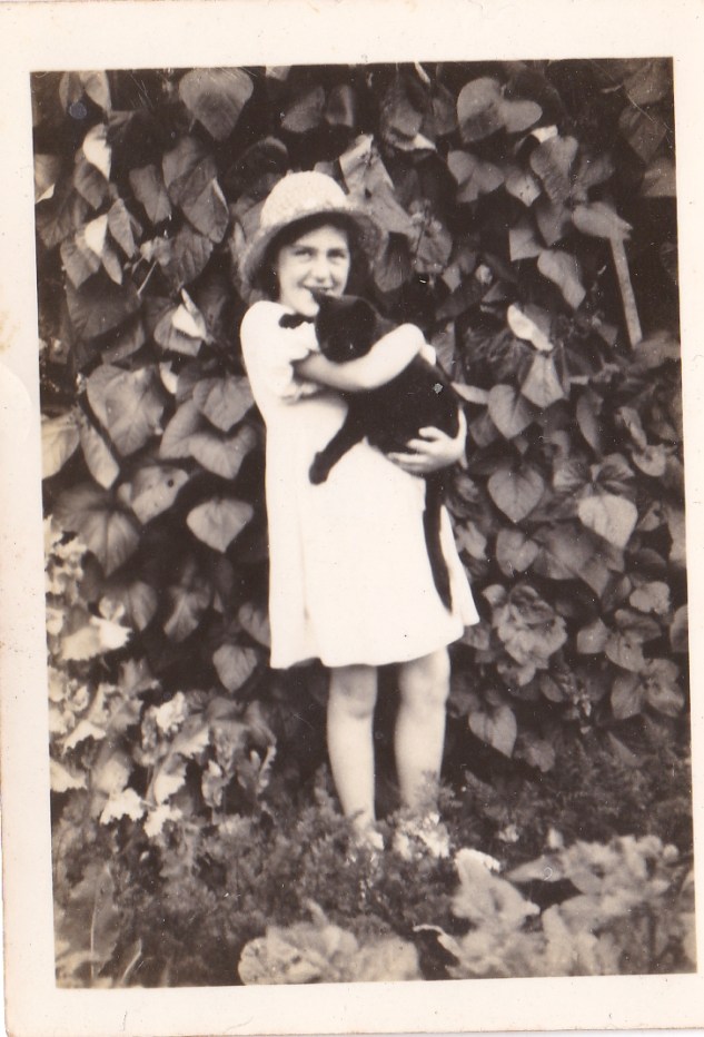 My mother with Blackjack in the garden at Macnaghten road, Bitterne, Southampton (1932).